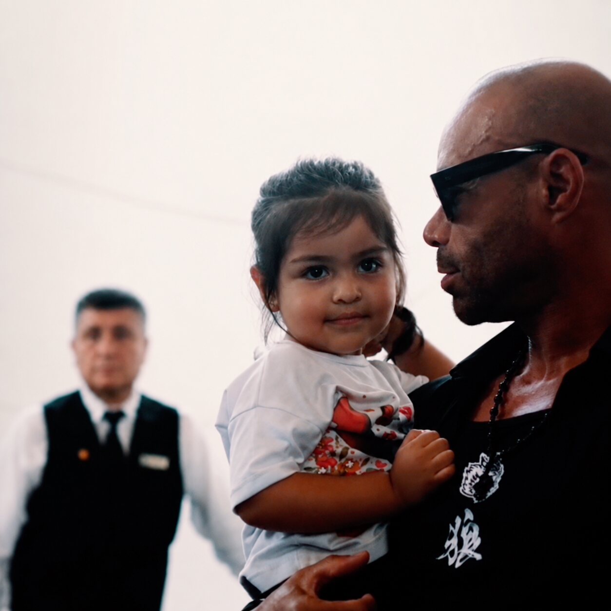 Kevin Levrone holding a young child at the World Tour stop in Mexico